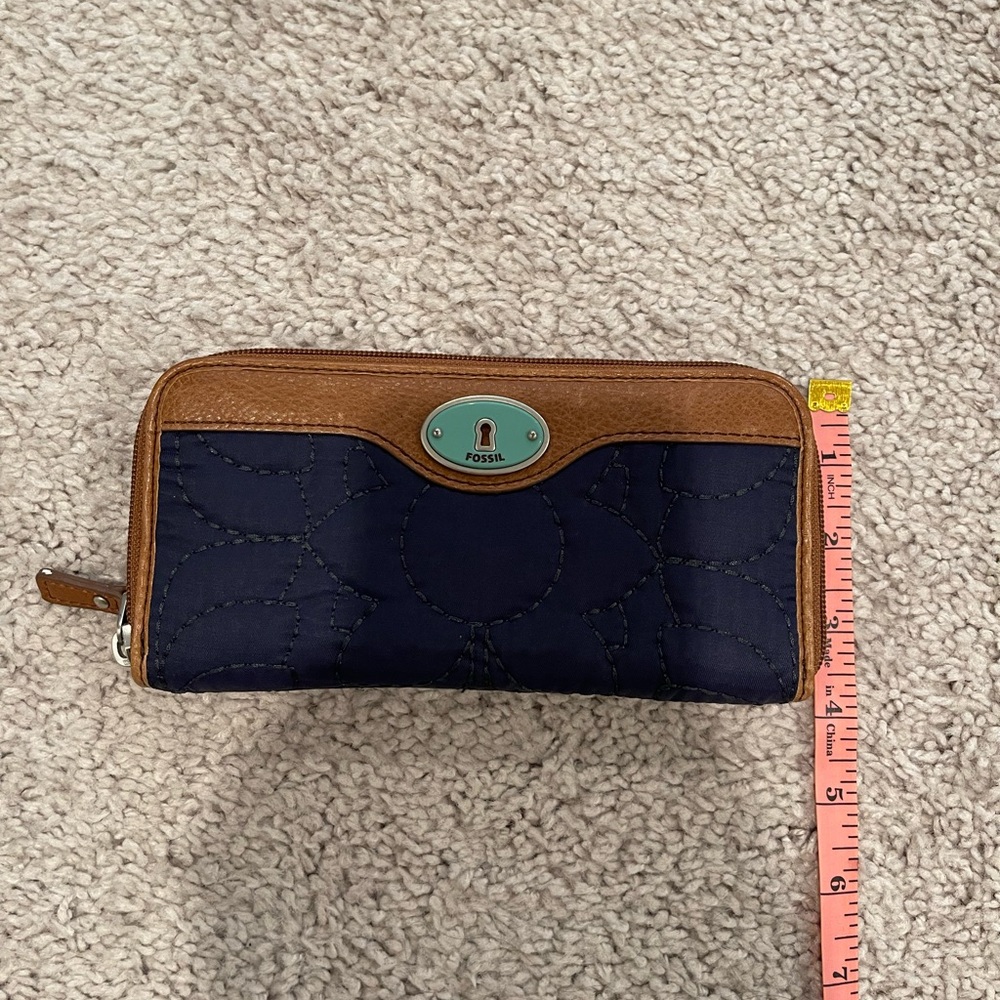 Fossil wallet. Blue with brown trim. Barely used.